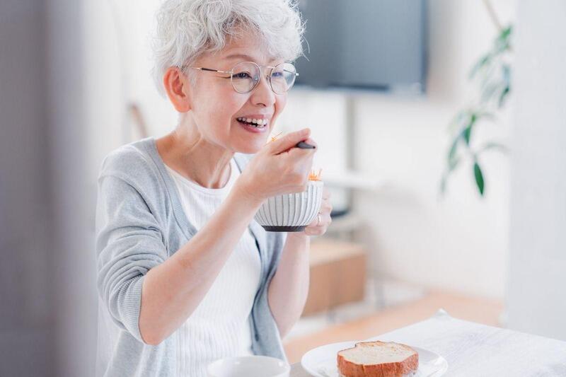 elderly_woman_eating_breakfast.jpg